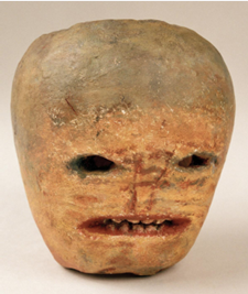 a turnip carved with an angry face.